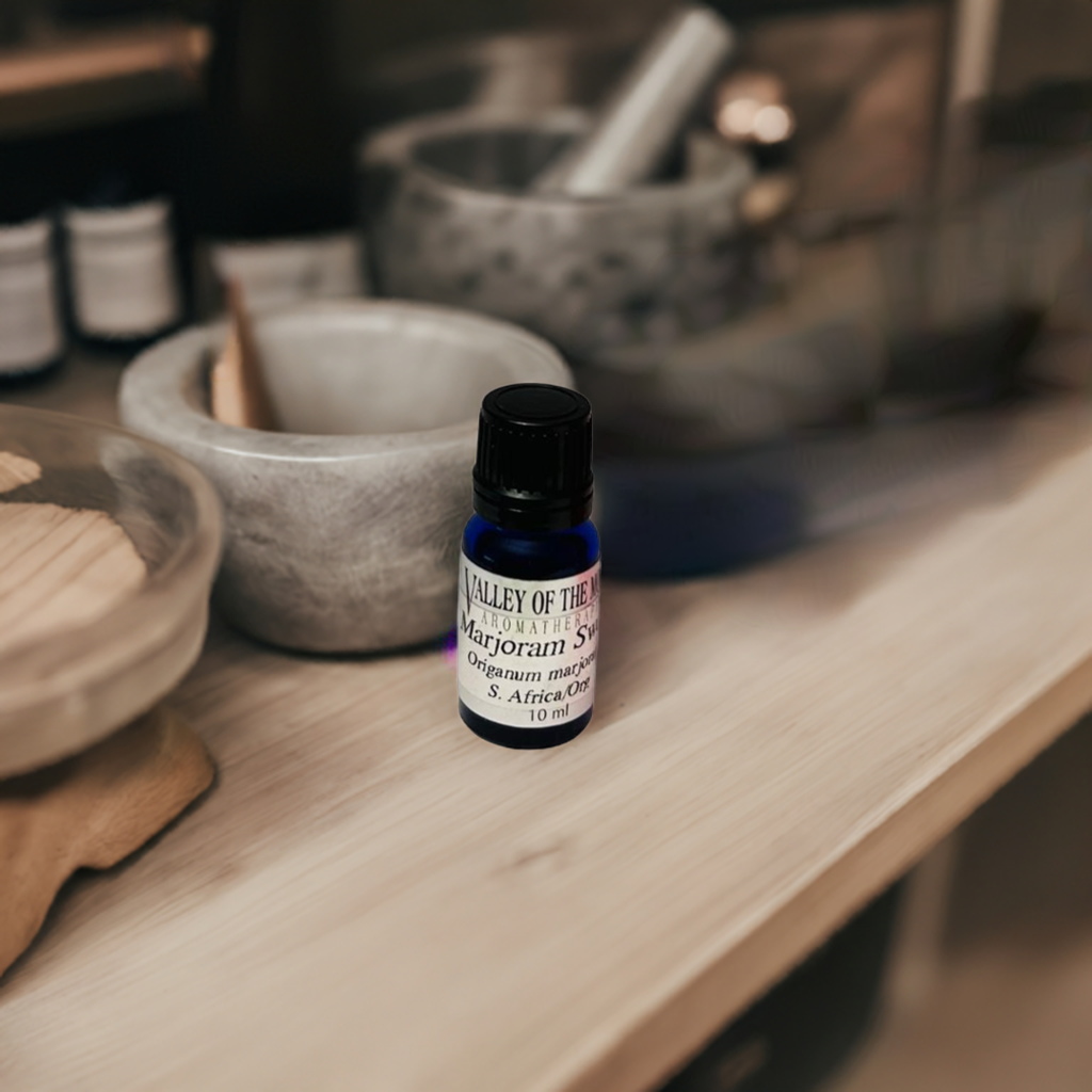 Small bottle of Valley of the Moon Syrup on a wooden surface with blurred background