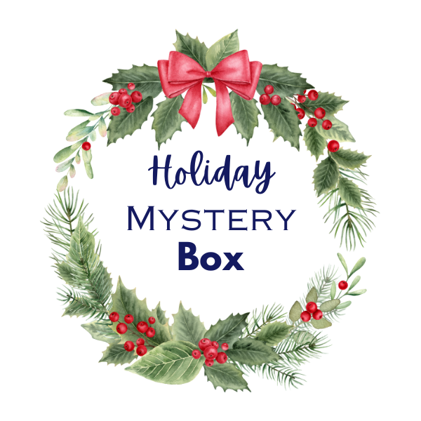 holiday mystery box on white background with greenery and red bow