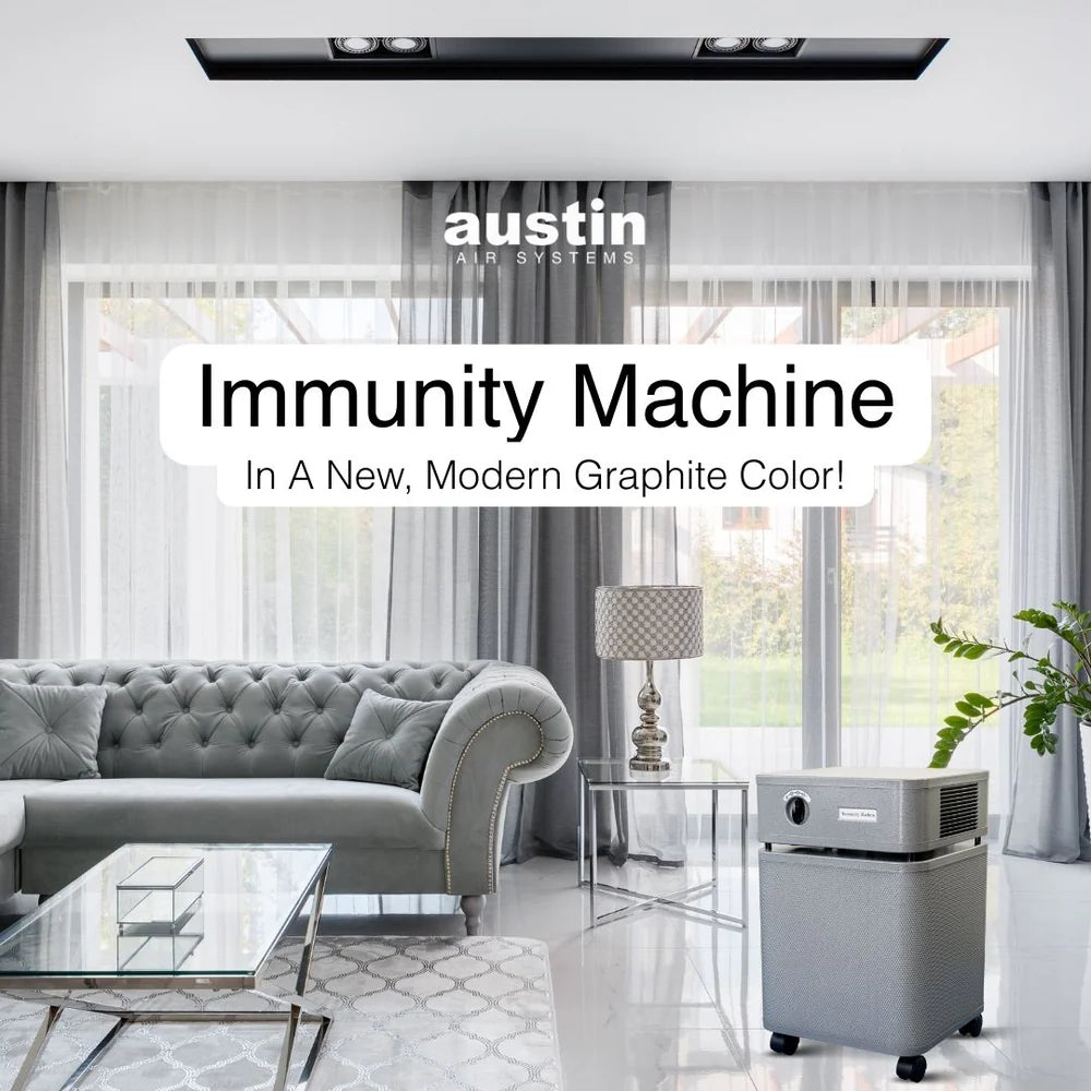 Modern living room with a gray air purifier labeled 'Immunity Machine' by Austin Air Systems.
